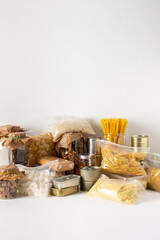Home food supplies, necessary food for the period of quarantine and isolation, the concept of stay at home, canned food and cereals, various pasta and flour, sugar and cookies, honey and coffee
