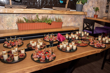 set table with delicious salads and snacks. Horizontal top view. Selective focus. Celebration concept and set table with food