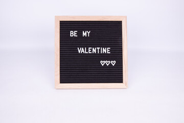 A sign that says Be My Valentines on a white background