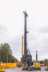 A pile driver on the construction site 