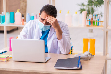 Young male chemist testing soap in the lab