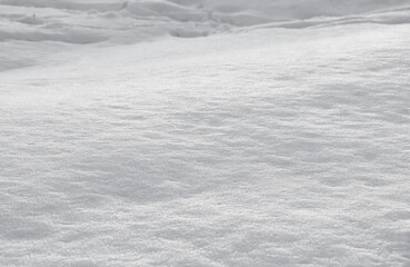 Background with white snow. Snow drifts, hills and mountains.