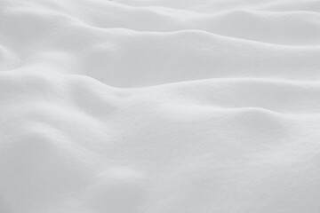 Background with white snow. Snow drifts, hills and mountains.