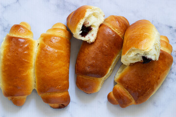 Yeast dough rolls stuffed with jam and nuts.