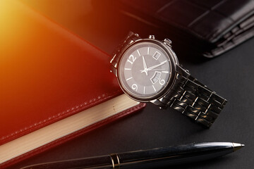 business time management concept. male luxury watch at workplace