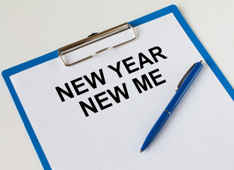 Clipboard with text New Year New me and blue pen