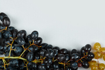 A bunch of red grapes on white background
