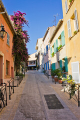 Fototapeta na wymiar Saint Tropez, Old city street view with colorful houses, Côte d'Azur. France, Europe
