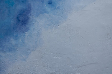 Abstract blue and white painted wall texture background outdoors