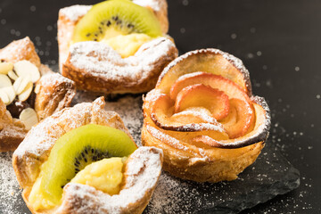 Home made puff pastries on dark background