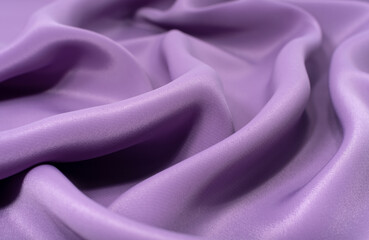 Obraz premium A piece of purple cloth. Fabric texture for background and design works of art, beautiful wrinkled pattern of silk or linen. A crumpled piece of cloth