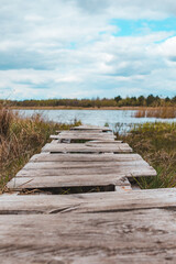 Obraz premium view of wooden old dock at lake beach