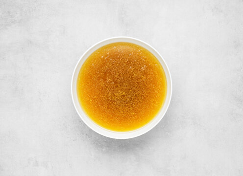 beef broth on gray concrete background