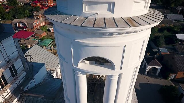 Aerial view of a christian cathedral with bell tower and domes.