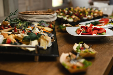 wedding candy bar. a festive table filled with different types of sweets. a wedding treat. buffet...