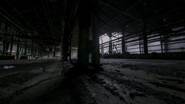 Old abandoned factory - motion control time-lapse dolly shot moves across ugly floor.