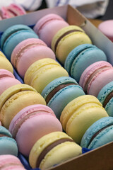 Macaroon dessert gift for valentine's day. Multi-colored cookies with cream.