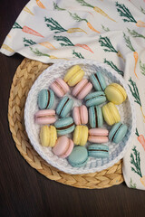 Macaroon dessert gift for valentine's day. Multi-colored cookies with cream.