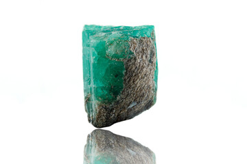 macro mineral stone emerald on a white background