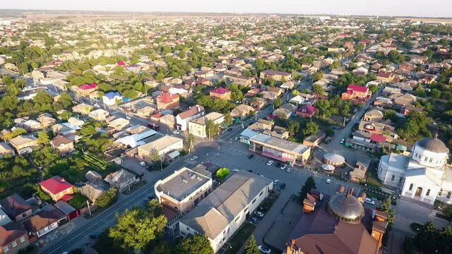 Aerial copter view of a village city and chyrch in a sunny day.