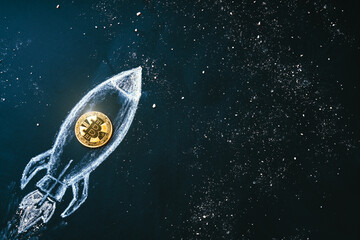Bitcoin logo rocket launcher, cryptocurrency concept. The growth rate of the gold coin for...