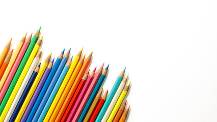 Fototapeta premium Closeup of colored pencils isolated on white, top view