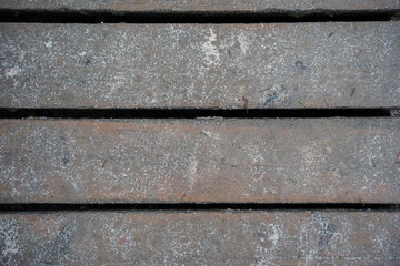 the board deck for walking is wet and sandy