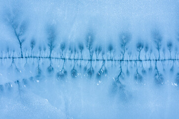 Large crack in the ice surface of a frozen lake.