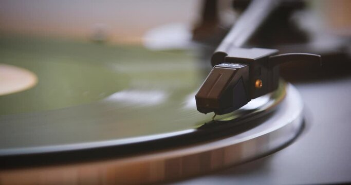 Vintage. The vinyl record is spinning. The needle plays on a vintage vinyl record. Old turntable