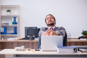 Young male employee working in the office