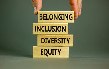 Equity, diversity, inclusion and belonging symbol. Wooden blocks with words 'equity, diversity,...