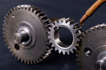 Coating gears with oil. Accessories and spare parts for industrial machinery.