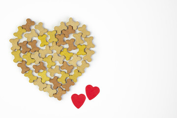 Dried food for dog puppy, with a shape of heart on white background with copy spase   .Valentines day concept .