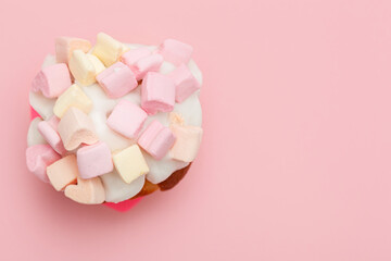 cupcake with hearts from marshmallow on a pink background
