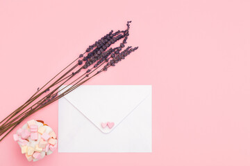 craft closed paper envelope for mail post and lavender isolated on the pink