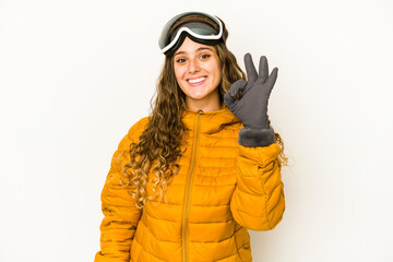 Young caucasian snowboarder woman isolated cheerful and confident showing ok gesture.