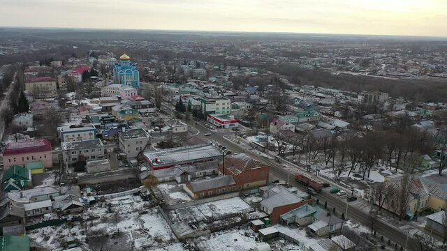 Aerial view of small Russian town of Dankov overlooking Cathedral of Our Lady of Tikhvin in murky winter day, Lipetsk Oblast . High quality 4k footage