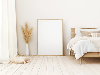 Vertical frame mockup standing on floor in boho bedroom interior with wooden bed, beige blanket, cushion with tassels, dried pampas grass on white wall background. 3d rendering, 3d illustration © marina_dikh