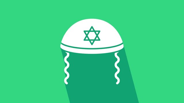 White Jewish kippah with star of david and sidelocks icon isolated on green background. Jewish yarmulke hat. 4K Video motion graphic animation