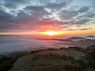 Fototapeta na wymiar Ayen (Corrèze, France) - Vue aérienne d'un lever de soleil hivernal depuis Puy d'Ayen