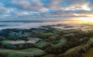 Ayen (Corrèze, France) - Vue panoramique aérienne du lever de soleil depuis le Puy d'Ayen
