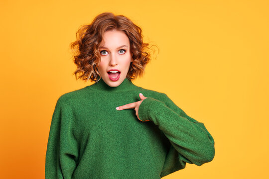 Astonished Young Woman Pointing At Chest