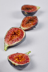 Ripe fig slices on a white background