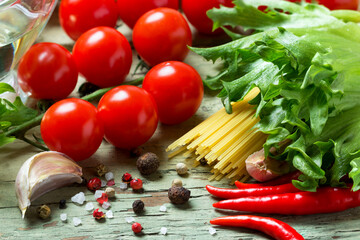 Naklejka na ściany i meble Ingredients for making pasta with tomato sauce.