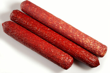 Three smoked sausages of different varieties