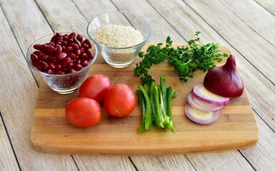 Whole organic fresh ingredients for making homemade tasty healthy vegetarian hearty one pot winter comfort chillis, soups and stews