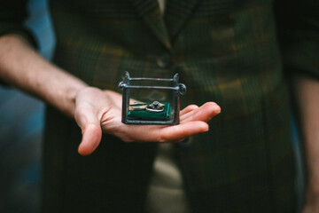 Rings in casket. In the hands of a box with rings.
