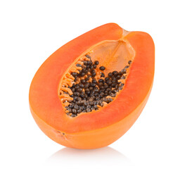 whole and half ripe papaya isolated on white background