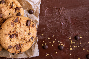 dark chocolate chip cookie round gold concept Organic fresh bake homemade tasty sweet dessert piece of closeup on cookie on wooden table for holiday new year Christmas gift sugar sparkle