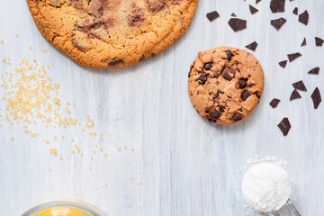 dark chocolate chip cookie round gold concept Organic fresh bake homemade tasty sweet dessert piece of closeup on cookie on wooden table for holiday new year Christmas gift sugar sparkle